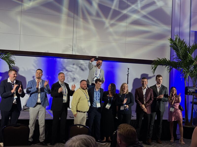 A group of PBExpo attendees gathered on stage during the event