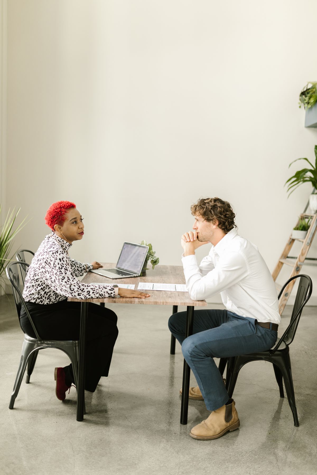 Financial advisor meeting with a client at a desk