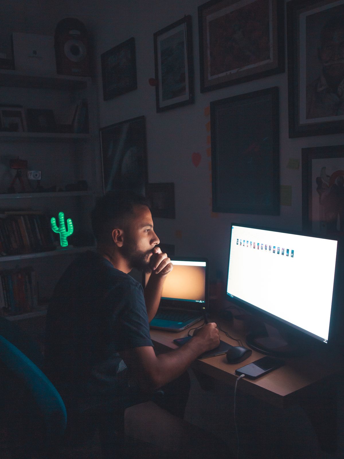 Security analyst monitoring threats at a workstation